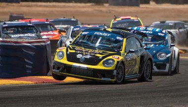 A VW Beetle struggles to maintain its lead during the Global Rallycross