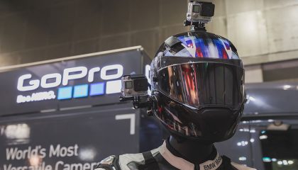 A GoPro camera mounted on a motorcycle helmet.