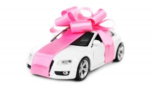 A car wrapped as a present shows some gift ideas for car lovers.