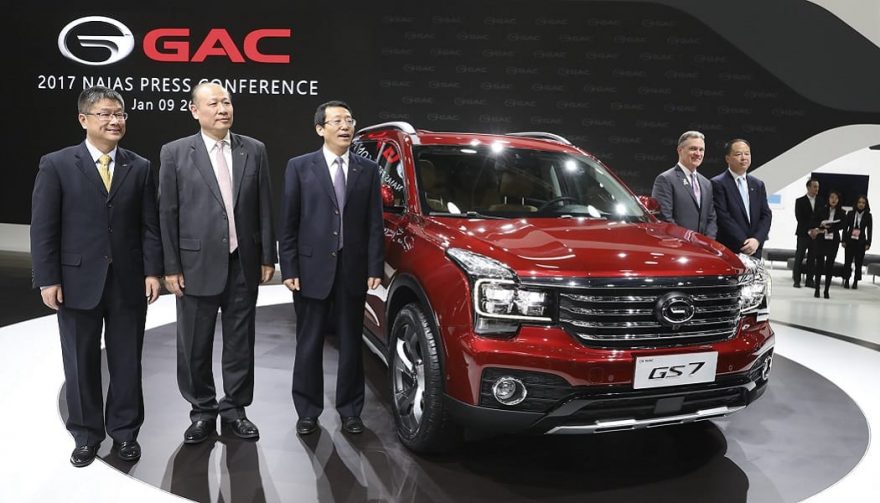 GAC Motors executives standing next to the GS7 mid-size SUV