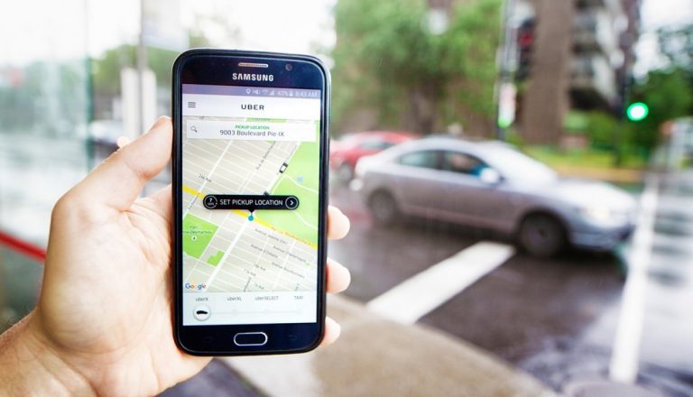 An Uber passenger waits for his ride.