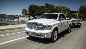 A 2017 Ram 1500 truck tows a large boat