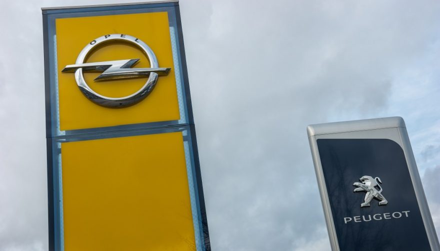 Opel and Peugeut dealership signs