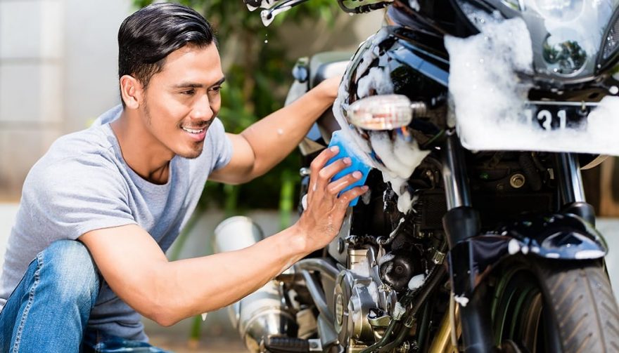 A man knows how to clean a motorcycle the right way