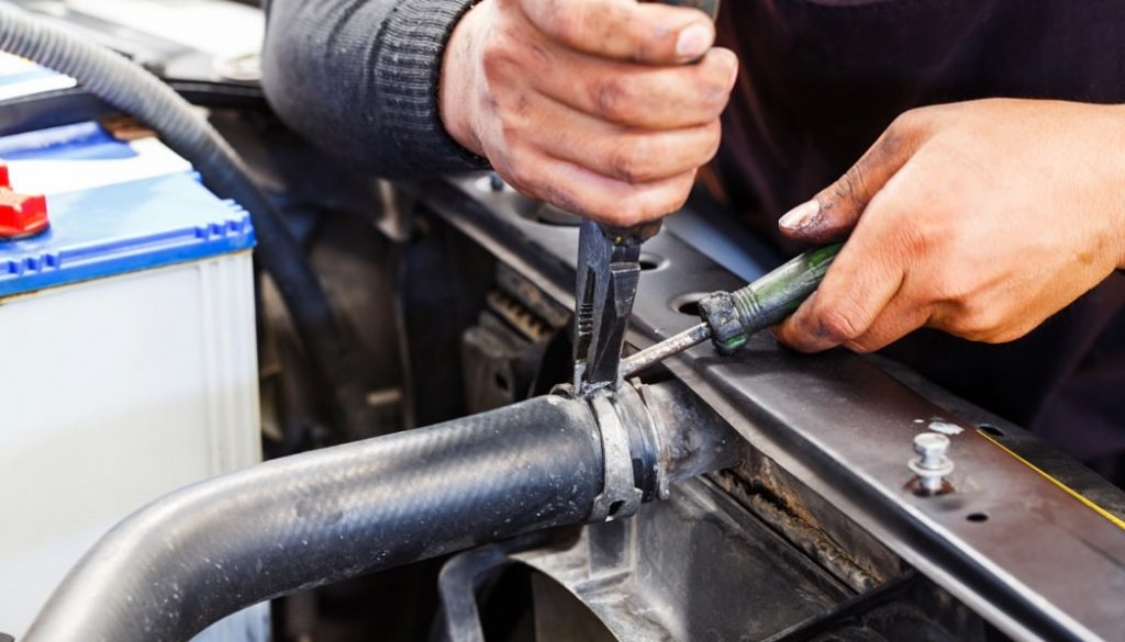 A mechanic working on a car knows how to fix a leakyk radiator