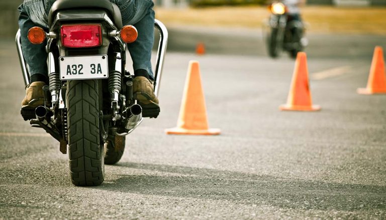 A rider learns how to ride a motorcycle