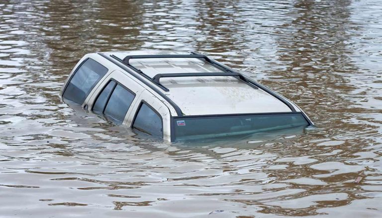 A flood damage car is under water