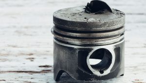 A piston is broken as a result of low speed pre ignition