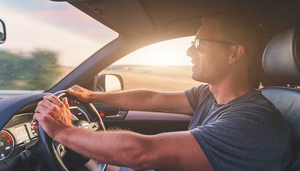 A man driving in his car