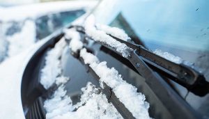 Melting snow on windshield wipers.