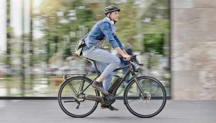 A man riding on an electric bike.