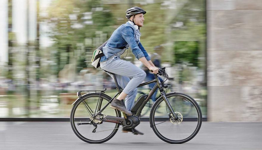 A man riding on an electric bike.